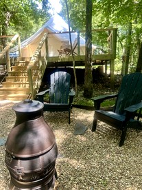 Enchanting Mountain Glamping Tents with Elevated Decks and Fire Pit Near Gentry, AR - Gentry, Arkansas - glamping.directory