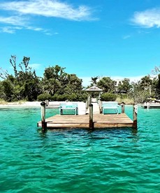 Charming Beachfront Cottage with Private Dock on Little Gasparilla Island, Florida - Placida, Florida - glamping.directory