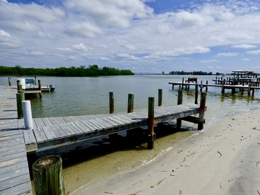 Charming Beachfront Cottage with Private Dock on Little Gasparilla Island, Florida - Placida, Florida - glamping.directory