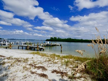 Charming Beachfront Cottage with Private Dock on Little Gasparilla Island, Florida - Placida, Florida - glamping.directory