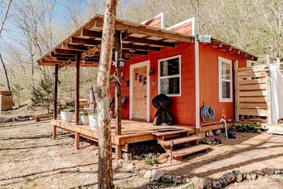 Cozy Riverfront Cabin with Outdoor Cedar Shower near Route 66 in St. Robert, Missouri - glamping.directory