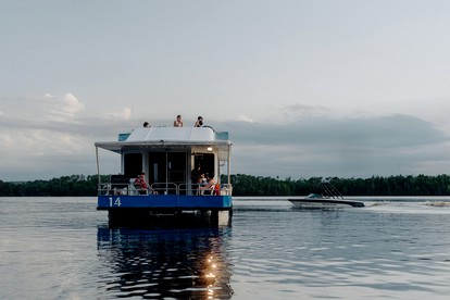 Luxury Wide-Body Houseboat with Flybridge Steering & Water Slide Near Birch Lake, Babbitt, Minnesota - Babbitt, Minnesota - glamping.directory