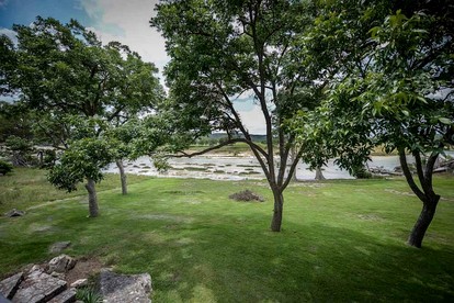 Riverfront Cabin with Spacious Interior, Large Deck and Views in Texas - Wimberley, Texas - glamping.directory