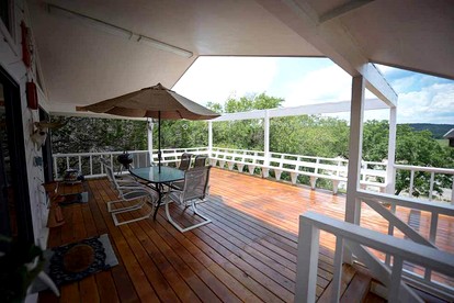 Riverfront Cabin with Spacious Interior, Large Deck and Views in Texas - Wimberley, Texas - glamping.directory