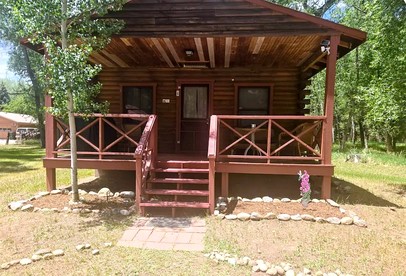 Charming Woodland Cabin with Cozy Porch & Green Space in Cripple Creek, Colorado - Cripple Creek, Colorado - glamping.directory