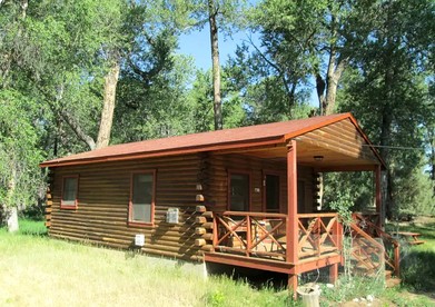 Charming Woodland Cabin with Cozy Porch & Green Space in Cripple Creek, Colorado - glamping.directory