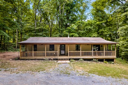 Modern Cabin with Hot Tub, Covered Porch, Fire Pit, and WiFi in Berkeley Springs, West Virginia - glamping.directory