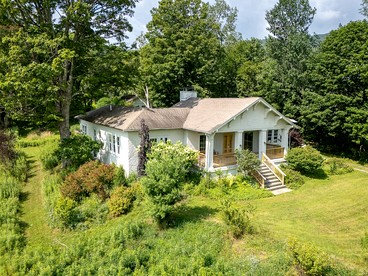 Charming Spanish Courtyard Retreat with Garden & Porch Views in Margaretville, New York - glamping.directory