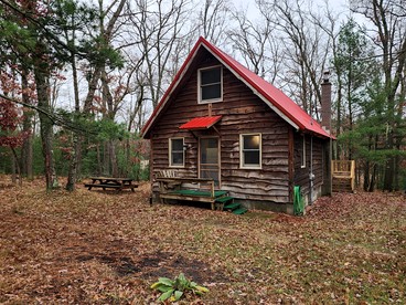 Secluded Luxury Cabin with Hot Tub on 10 Private Acres near Trails in Reed City, Michigan - glamping.directory
