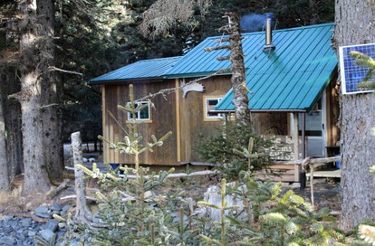 Coastal Camping Cabin with Wood-Burning Stove on Whale Island, Alaska - glamping.directory