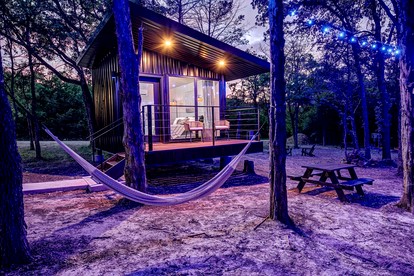 Serene Woodland Cabin Oasis near Trinity River in Texas - glamping.directory