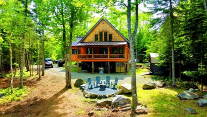Wooden Lake Cabin Loaded with Kayaks in Maine - glamping.directory