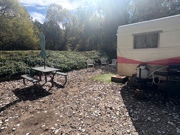 Charming Vintage Shasta Camper with Riverside Glamping Charm Near Pavilion Food Truck Scene in Mayhill, New Mexico - Mayhill, New Mexico - glamping.directory