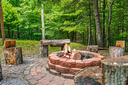 Mountain River Cabin with Hot Tub, Fire Pit and Kayaks for Your Fun Family Getaway in the Mountains of Great Cacapon, WV - Great Cacapon, West Virginia - glamping.directory