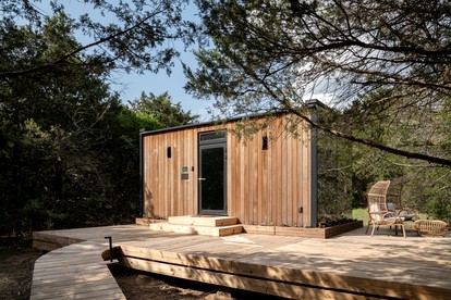 Whimsical Flower-Inspired Mirror Cabin by the Lake in the Enchanted Forests of Texas - glamping.directory