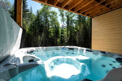Stunning Cottage with Spa in the Woods in Baie-Saint-Paul, Quebec - Charlevoix, Michigan - glamping.directory