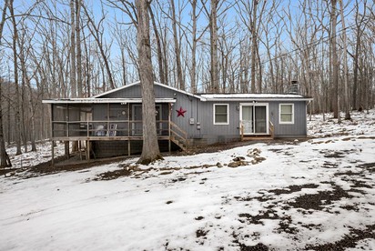 Dog Friendly Cabin with a Wood Burning Stove, Screened-In Porch, and River Access near Cacapon Resort State Park, WV - Great Cacapon, West Virginia - glamping.directory