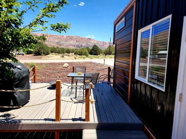 Modern Comforts, Rustic Charm: Tiny House Hideaway with Deck in Apple Valley - Apple Valley, Utah - glamping.directory