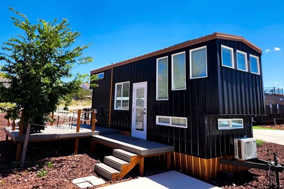 Modern Comforts, Rustic Charm: Tiny House Hideaway with Deck in Apple Valley - glamping.directory
