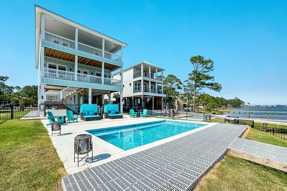 Luxurious Waterfront Lagoon Home with Heated Pool & Private Dock near Gulf Shores, Alabama - glamping.directory