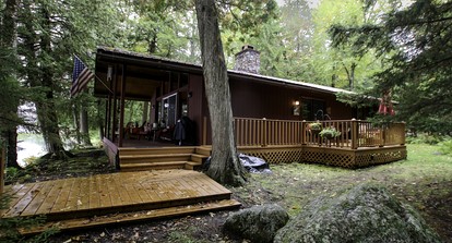 Cozy Cottage Surrounded by Trees with Private Dock for a Peaceful Escape by Big Moose Lake in New York - glamping.directory