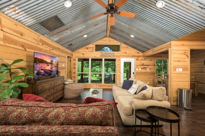 Stunning Riverfront Log Cabin Nestled Amidst Trees in Nashoba, Oklahoma - Nashoba, Oklahoma - glamping.directory