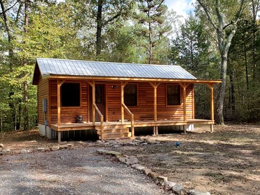 Stunning Riverfront Log Cabin Nestled Amidst Trees in Nashoba, Oklahoma - glamping.directory