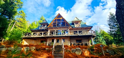 Rustic Luxury Retreat with Panoramic Lake & Mountain Views in Beaver Cove, Maine - glamping.directory