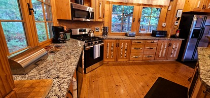 Rustic Luxury Retreat with Panoramic Lake & Mountain Views in Beaver Cove, Maine - Beaver Cove, Maine - glamping.directory