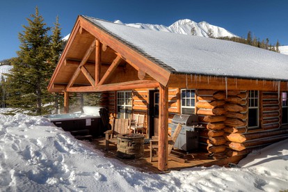 Rustic and Cozy Log Cabin with Ski-in Access, Hot Tub, and Fire Pit in Big Sky, Montana - glamping.directory