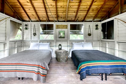 Three Cozy Historic Scout Cabins with Fire Pit, BBQ, and Hammocks for a Memorable Family Adventure in Troy, Wisconsin - East Troy, Wisconsin - glamping.directory
