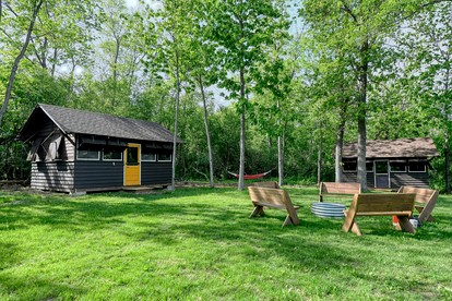 Three Cozy Historic Scout Cabins with Fire Pit, BBQ, and Hammocks for a Memorable Family Adventure in Troy, Wisconsin - glamping.directory