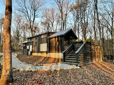 Chic Tiny Cabin with Jacuzzi, Screened Porch and Grill in Tennessee - glamping.directory
