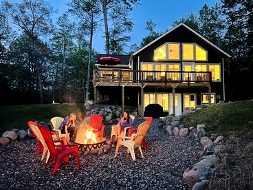 Group Lake Cabin with Ping Pong Table Loaded with Kayaks in Wisconsin - glamping.directory