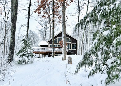 Group Lake Cabin with Ping Pong Table Loaded with Kayaks in Wisconsin - Stone Lake, Wisconsin - glamping.directory