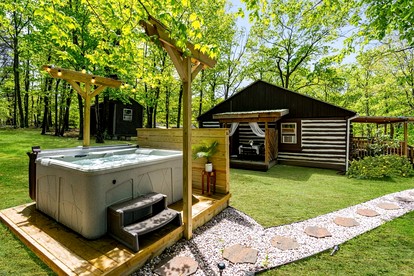 Modernized Log Cabin with Hot Tub, Fire Pit and Amazing Views Just Minutes from the Cacapon Mountains in Berkeley Springs, WV - Berkeley Springs , West Virginia - glamping.directory