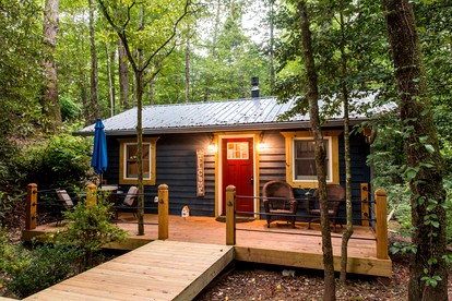 Romantic Creekside Cabin Retreat with Hot Tub, Fire Pit and Peaceful Forest Views in Sautee Nacoochee, Georgia - glamping.directory