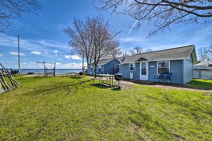 Pet-Friendly Lake Cabin with Dock & Kayaks & Fire Pit in Houghton Lake, Michigan - glamping.directory