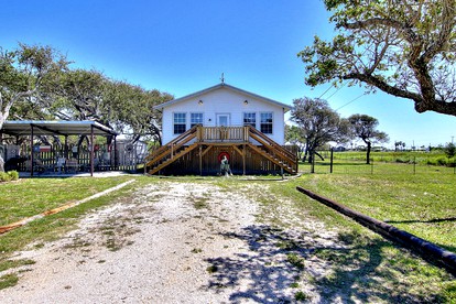 Family Style Fishing Cabin with Porch and Grill Perfect for Group Getaways on the Conn Brown Harbour, Aransas Pass Texas - glamping.directory