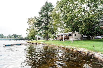 Lakefront Homey Cottage Offering Pristine Views of Cobosseecontee Lake from the Deck in Winthrop, Maine - glamping.directory