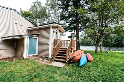 Lakefront Homey Cottage Offering Pristine Views of Cobosseecontee Lake from the Deck in Winthrop, Maine - Winthrop, Maine - glamping.directory