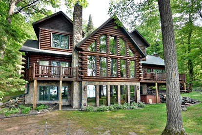 Luxury Log Cabin for Families with Private Boat Dock on Round Lake in Hayward, Wisconsin - glamping.directory