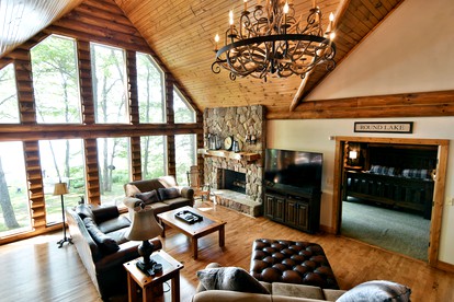 Luxury Log Cabin for Families with Private Boat Dock on Round Lake in Hayward, Wisconsin - Hayward, Wisconsin - glamping.directory