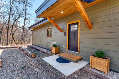 Secluded Riverfront Cabin with Scenic Bluffs near Fayetteville, Arkansas - glamping.directory