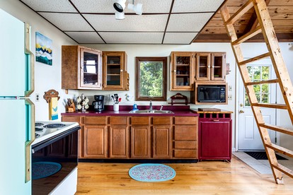 Mountainside Cabin with Hot Tub, Fire Pit and Deck Tucked Away in the Woods of Great Cacapon, WV - Great Cacapon, West Virginia - glamping.directory
