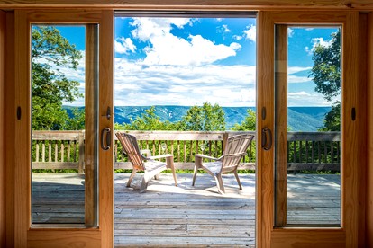 Mountainside Cabin with Hot Tub, Fire Pit and Deck Tucked Away in the Woods of Great Cacapon, WV - Great Cacapon, West Virginia - glamping.directory