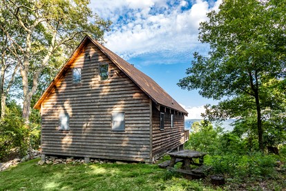 Mountainside Cabin with Hot Tub, Fire Pit and Deck Tucked Away in the Woods of Great Cacapon, WV - glamping.directory