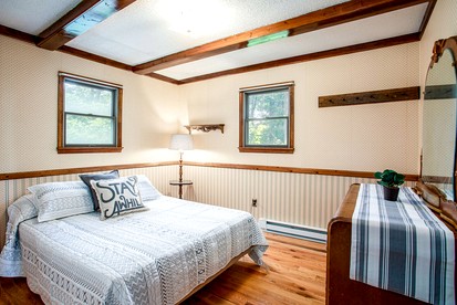 Mountainside Cabin with Hot Tub, Fire Pit and Deck Tucked Away in the Woods of Great Cacapon, WV - Great Cacapon, West Virginia - glamping.directory