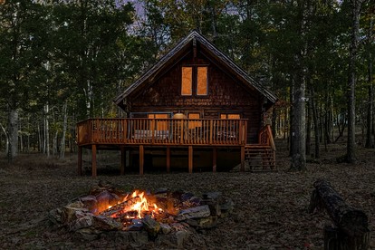Log Cabin with Hot Tub, Fire Pit and Spacious Deck Nestled in the Woods of Great Cacapon, WV - Great Cacapon, West Virginia - glamping.directory