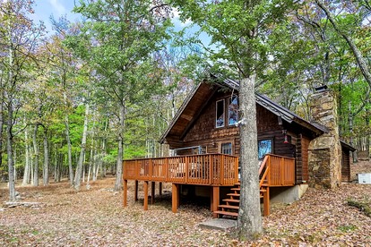Log Cabin with Hot Tub, Fire Pit and Spacious Deck Nestled in the Woods of Great Cacapon, WV - glamping.directory